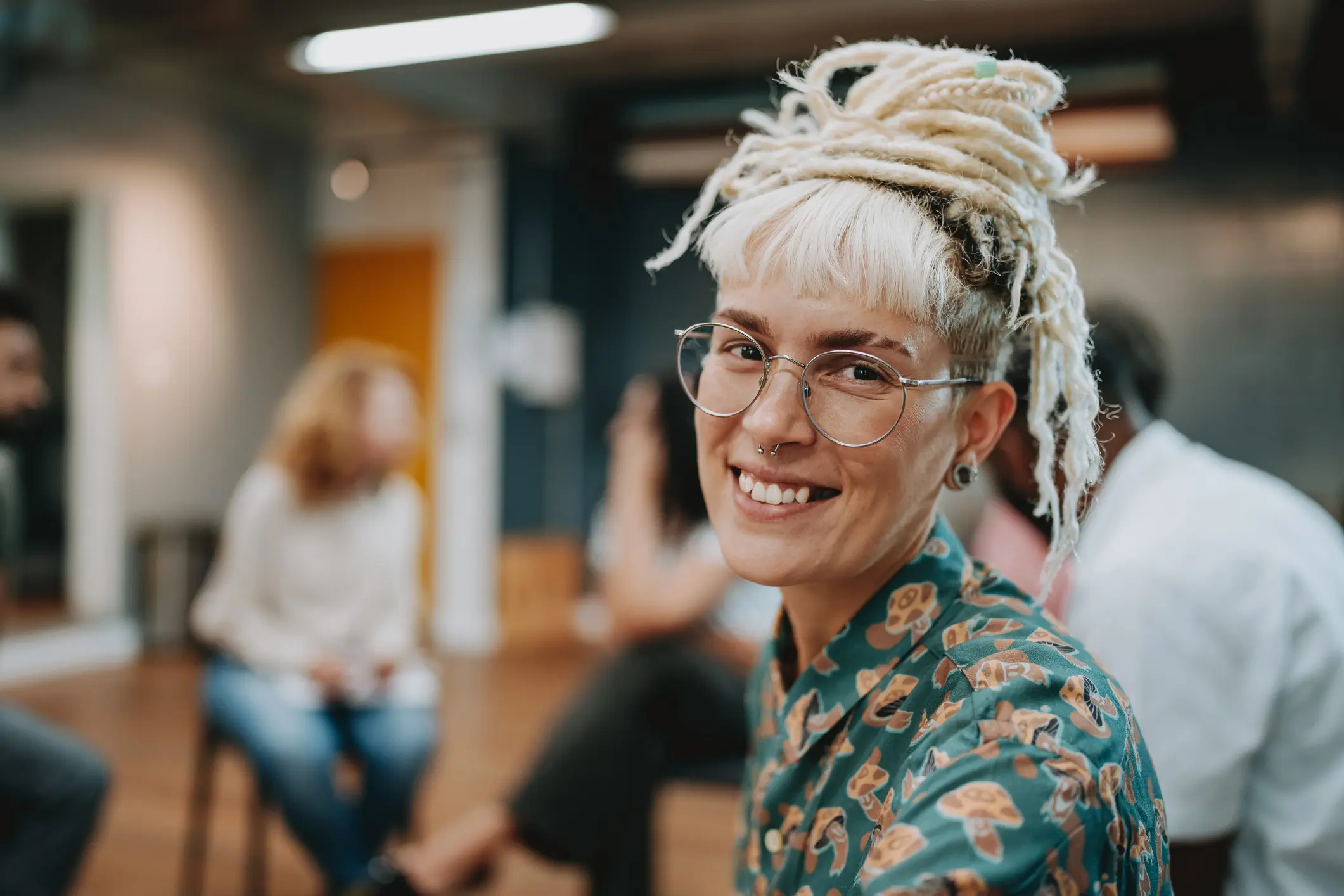 Portrait of non-binary person in group therapy Dual Diagnosis