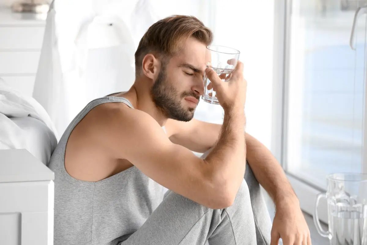 a man struggles with the side effects of alcohol and ghb after a night out