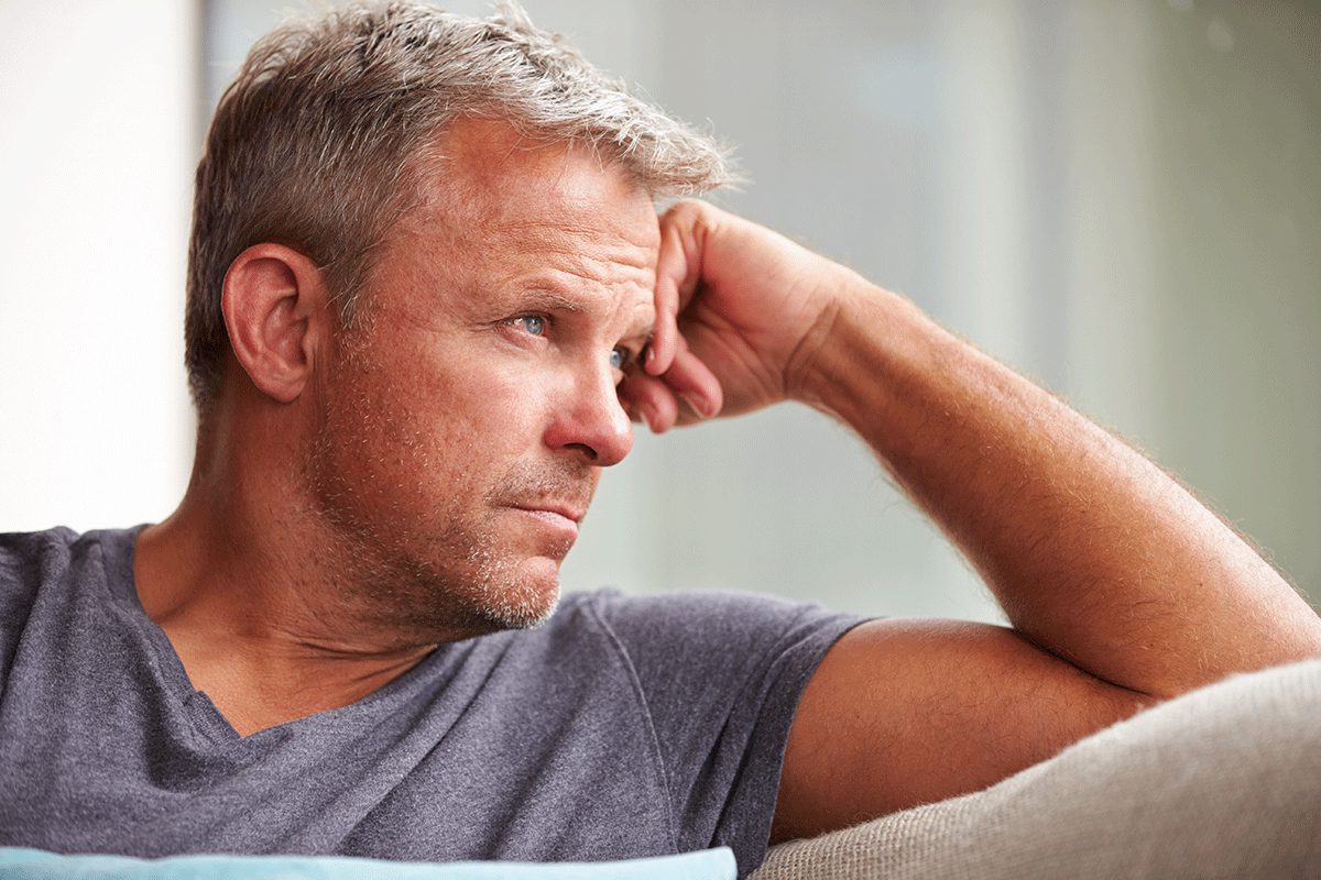 a man struggles with the symptoms of wet brain due to alcohol addiction